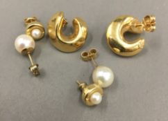 A pair of 18 ct gold earrings,