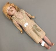 An antique German bisque headed doll, by Recknagel,