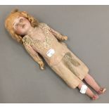 An antique German bisque headed doll, by Recknagel,