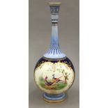 A fine blue scale Royal Worcester bottle vase painted with pheasants within panels.