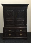 A Georgian carved oak cupboard over drawers