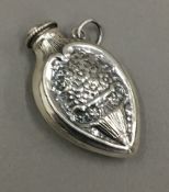 A silver scent bottle pendant