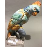 A porcelain figure of a parrot,