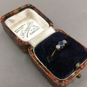 An 18 ct gold and platinum diamond and sapphire ring