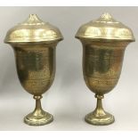 A pair of engraved Indian brass lidded vases