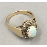 A 9 ct gold opal and diamond ring