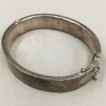 A silver hinged cuff bangle (21 grammes total weight)