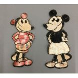 Two vintage needleworks depicting an early Mickey Mouse and Minnie Mouse