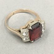 A 9 ct gold red stone ring