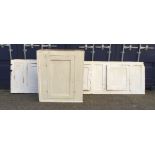 A Victorian white painted pine cupboard and a large Victorian white painted pine cupboard front