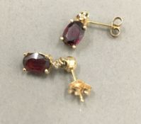 A pair of 14 ct gold diamond and ruby set drop earrings (1 gramme total weight)