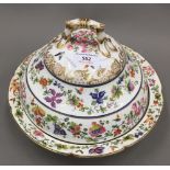 An early 19th century painted porcelain tureen and cover