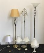 A quantity of floor standing and table lamps