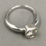 A 14 K white gold solitaire ring
