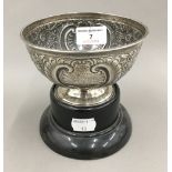 A small silver bowl on stand