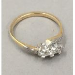 An unmarked gold diamond set ring