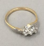 An unmarked gold diamond set ring