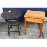 A small wooden school desk with lift up-lid and a mid 20th century round wooden pub table