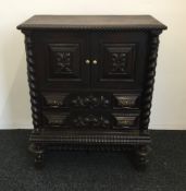 A 19th century carved side cupboard