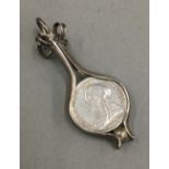 A silver framed Victorian thrupence pendant (4 grammes total weight)