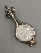 A silver framed Victorian thrupence pendant (4 grammes total weight)