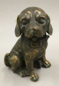 A bronze model of a cute little puppy