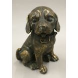 A bronze model of a cute little puppy