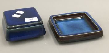 A Scandinavian stoneware butter dish with cover and stand