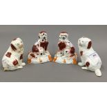 Two pairs of 19th century Staffordshire spaniel groups,