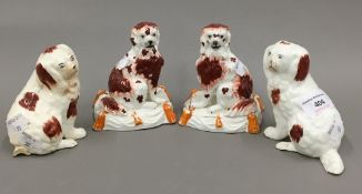 Two pairs of 19th century Staffordshire spaniel groups,