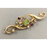 A 15 ct gold Edwardian gem and seed pearl set brooch (2 grammes total weight)