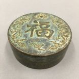 A Chinese bronze round box
