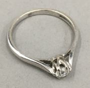 An 18 ct white gold solitaire ring (4 grammes total weight)