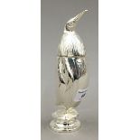 A silver plated castor in the form of a penguin
