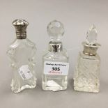 Three Victorian silver mounted cut glass scent bottles