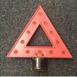 A vintage reflector set road hazard warning triangle