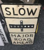 A vintage reflector set road sign - SLOW MAJOR ROAD AHEAD