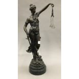 A patinated bronze figurine of Justice