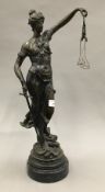 A patinated bronze figurine of Justice