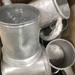 A collection of pewter tankards