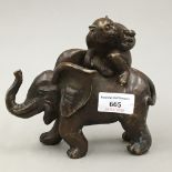 A bronze model of an elephant and monkey
