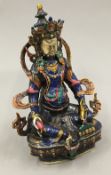 An enamel decorated deity