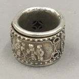 A Chinese silver archers ring