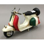 A tin model of a scooter