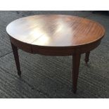 A late 19th/early 20th century oval satinwood extendable dining table