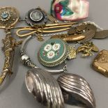 A collection of various brooches, etc.