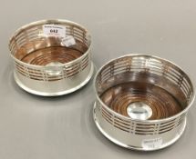 A pair of silver plated coasters