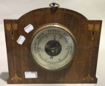 An Edwardian inlaid mahogany wall barometer