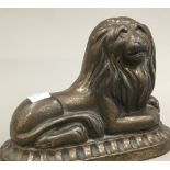 A Victorian patinated cast iron lion form doorstop