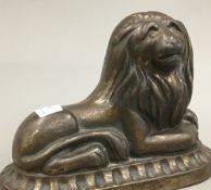 A Victorian patinated cast iron lion form doorstop